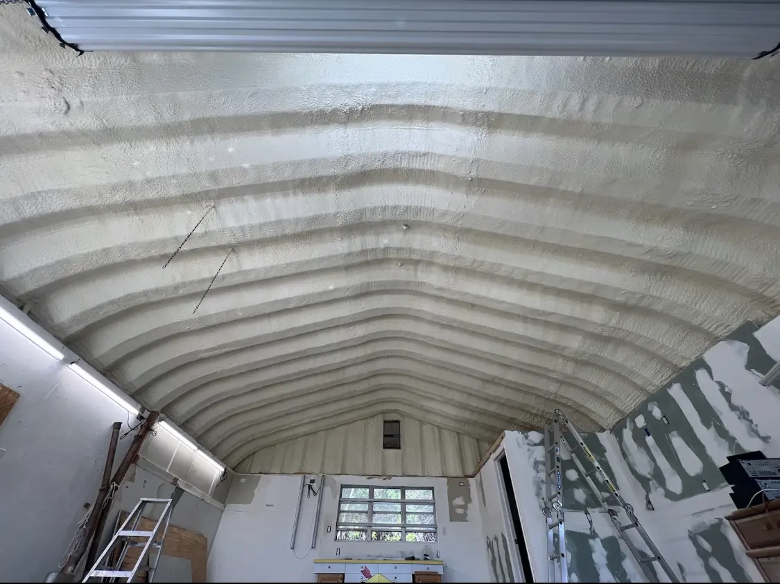 Spray polyurethane foam applied to the underside of a metal roof deck in Fairfax